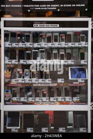 Second hand mobile phones for sale in a pawn shop in Wales. Stock Photo