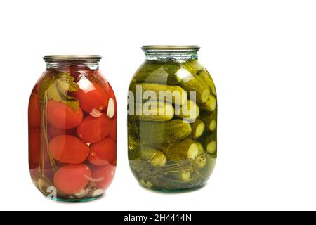 Jars of pickled cucumbers and tomatoes on white background, isolate. Preparations for winter Stock Photo