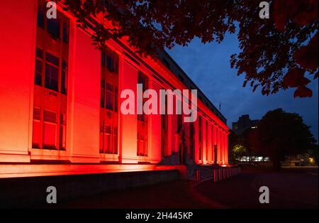 CARDIFF, WALES - MAY 28: The Welsh Government Building at Cathays Park lit up red in support of Wales in the Euros on May 28, 2021 in Cardiff, Wales. Stock Photo