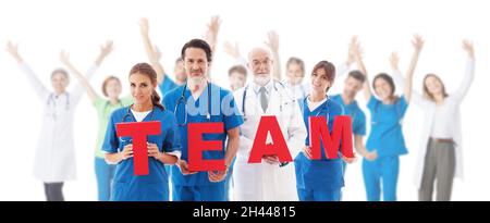 Group portrait of medical workers holding TEAM letters isolated on white background, doctor, nurse in uniform Stock Photo