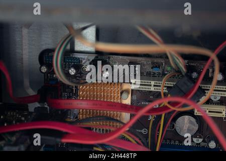 An old family computer filled with spider webs, dust and viruses. Maintenance is a key to keep computers healthy and working. Stock Photo