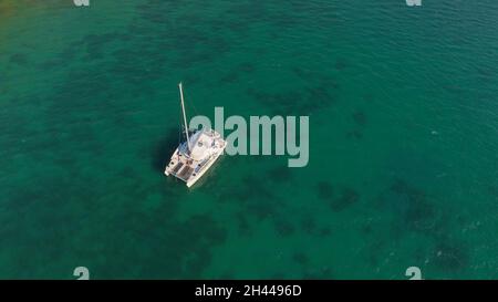 Aerial photo of moored sailing boat at Vathiavali port town in West Greece Stock Photo