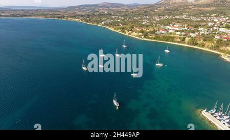 Aerial photo of moored sailing boat at Vathiavali port town in West Greece Stock Photo