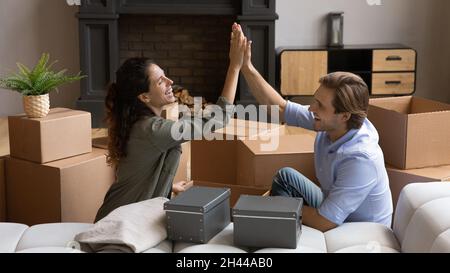 Couple giving high five feel happy celebrate relocation day Stock Photo
