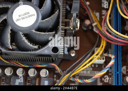 An old family computer filled with spider webs, dust and viruses. Maintenance is a key to keep computers healthy and working. Stock Photo