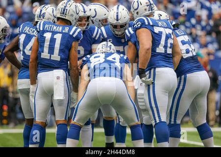 Indianapolis, Indiana, USA. 31st Oct, 2021. Tennessee Titans quarterback  Ryan Tannehill (17) tries to avoid the rush by Indianapolis Colts defensive  tackle Grover Stewart (90) in the game between the Tennessee Titans