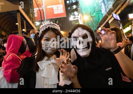 Hong Kong, China. 31st Oct, 2021. People wearing masks pose for photos during the Halloween celebration. (Photo by Alex Chan Tsz Yuk/SOPA Images/Sipa USA) Credit: Sipa USA/Alamy Live News Stock Photo