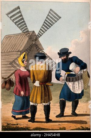 A man pours a drink for a woman carrying milk jugs and a man with an axe in his belt, as they all stand by a windmill. Coloured lithograph. Stock Photo