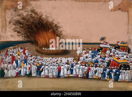 Sati (suttee): a widow immolating herself on her husband's funeral pyre as a large crowd watches. Gouache painting on mica by an Indian artist. Stock Photo