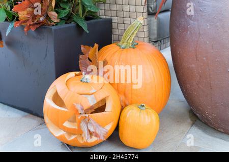Three different size of Carved pumpkins at Halloween night London England UK Stock Photo