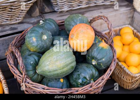Harvest time celebration with Pumpkins laid in basket London England Stock Photo