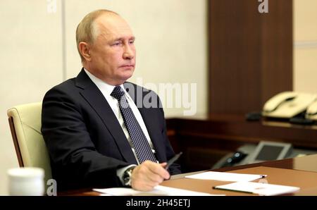 Novo-Ogaryovo, Russia. 31st Oct, 2021. Russian President Vladimir Putin, attends the second day of the G20 Summit leadership meeting via video conference from the Novo-Ogaryovo official residence October 31, 2021 in Moscow, Russia. Credit: Evgeniy Paulin/Kremlin Pool/Alamy Live News Stock Photo