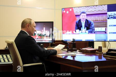 Novo-Ogaryovo, Russia. 31st Oct, 2021. Russian President Vladimir Putin, attends the second day of the G20 Summit leadership meeting via video conference from the Novo-Ogaryovo official residence October 31, 2021 in Moscow, Russia. Credit: Evgeniy Paulin/Kremlin Pool/Alamy Live News Stock Photo