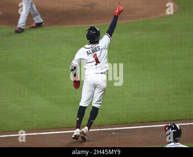 Atlanta, United States. 31st Oct, 2021. Atlanta Braves second baseman Ozzie Albies (1) celebrates watching his teammate Adam Duvall's grand slam during the first inning against the Houston Astros in game five in the MLB World Series at Truist Park on Sunday, October 31, 2021 in Atlanta, Georgia. Houston faces an elimination game trailing Atlanta 3-1 in the series. Photo by Kate Awtrey-King/UPI Credit: UPI/Alamy Live News Stock Photo