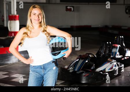 Woman standing near go-kart cars Stock Photo