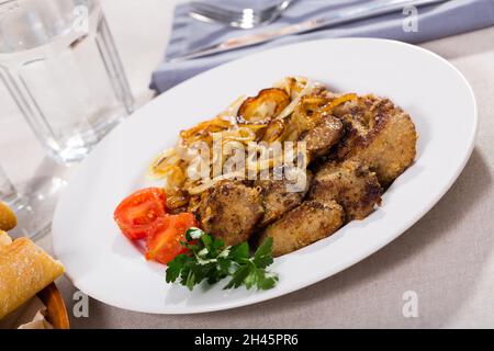 Fried rabbit liver with onion Stock Photo