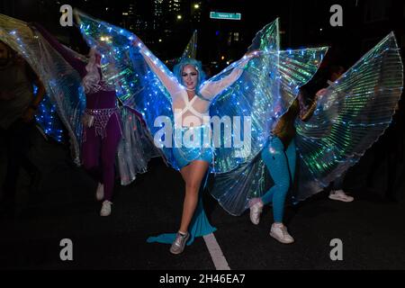 New York City, USA. 31st Oct, 2021. The annual Greenwich Village Halloween parade returned in 2021after a year's suspension because of COVID restrictions. Women with lighted gossamer wings. Credit: Ed Lefkowicz/Alamy Live News Stock Photo