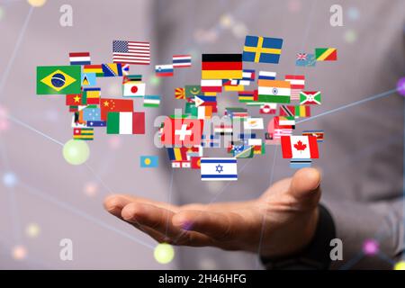 Person presenting the virtual projection of international country flags with binary codes Stock Photo
