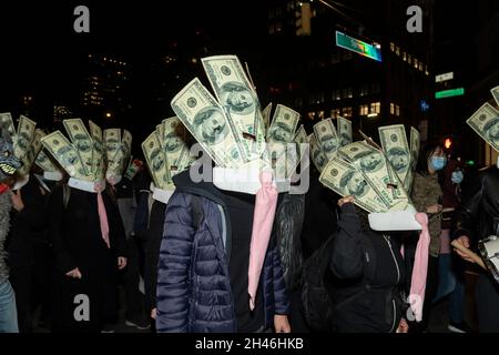 New York, NY - October 31, 2021: Atmosphere during 48th annual Village Halloween Parade attended by thousand participants and spectators along 6th avenue in Manhattan Stock Photo