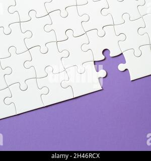 Set of white puzzle pieces and last one piece Stock Photo