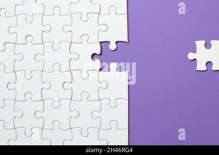 Set of white puzzle pieces and last one piece Stock Photo