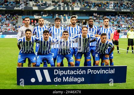 Malaga, Spain. 23rd Oct, 2021. Malaga CF players pose for group photo during the LaLiga SmartBank 2021/22 match between Malaga CF and CD Lugo at La Rosaleda Stadium. Final Score; Malaga CF 1:0 CD Lugo. (Photo by Francis Gonzalez/SOPA Images/Sipa USA) Credit: Sipa USA/Alamy Live News Stock Photo