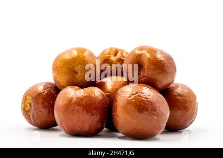 Jujube on a white background. Combined with a ripe jujube shade. Close up Stock Photo