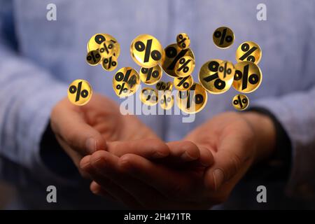 Person presenting the virtual projection of percent signs - sale or discount concept Stock Photo