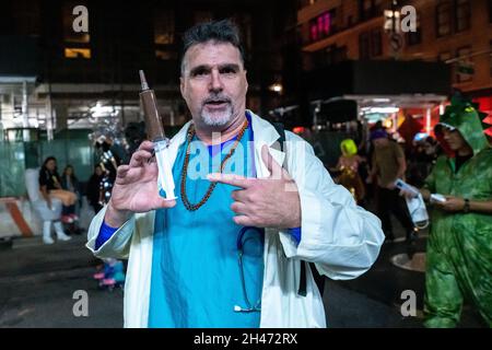 New York, USA. 31st Oct, 2021. People wear costumes as they attend the 48th annual Halloween Parade in New York City's Greenwich Village. The traditional event returned to New York city after two years, as the 2020 edition was cancelled due to COVID restrictions. Credit: Enrique Shore/Alamy Live News Stock Photo