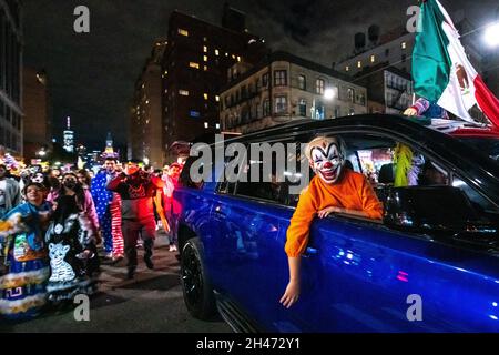 New York, USA. 31st Oct, 2021. People wear costumes as they attend the 48th annual Halloween Parade in New York City's Greenwich Village. The traditional event returned to New York city after two years, as the 2020 edition was cancelled due to COVID restrictions. Credit: Enrique Shore/Alamy Live News Stock Photo