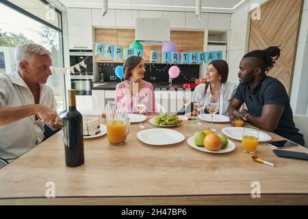 Family having happy time and dinner together Stock Photo