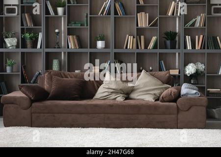 Comfortable sofa standing in modern stylish living room. Stock Photo