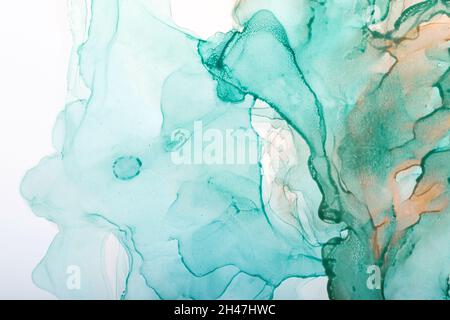 Watercolor alcohol ink swirls. Transparent waves in turquoise green colors. Delicate pastel spots Stock Photo
