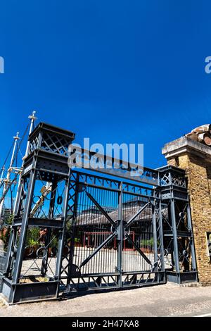 Entrace gate to the London Docks warehouse Tobacco Dock now serving as an  event space, Wapping, London, UK Stock Photo