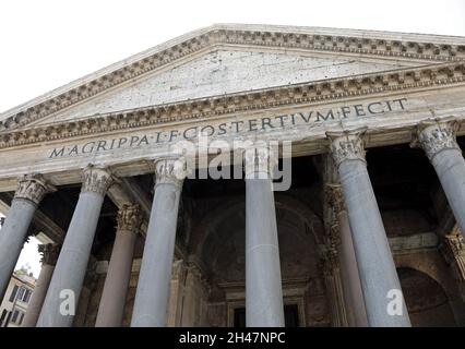 ancient temple Pantheon with the columns seen from below and the Latin inscription that means Marco Agrippa, son of Lucio built it in the year of his Stock Photo