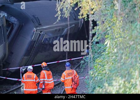 Officials from the Office of Road and Rail (ORR) and the Rail Accident Investigation Branch (RAIB) at the scene of a crash involving two trains near the Fisherton Tunnel between Andover and Salisbury in Wiltshire. Fifty firefighters were called to the scene of the collision on Sunday in which up to a dozen passengers are believed to have been injured. Picture date: Monday November 1, 2021. Stock Photo