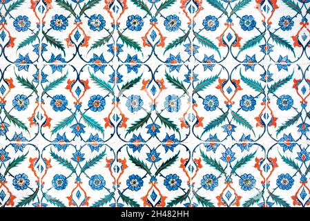 Vintage tiles on the wall of an old mosque. Traditional Islamic patterns as decorate. Arabian ceramic tiles with traditional patterns Stock Photo
