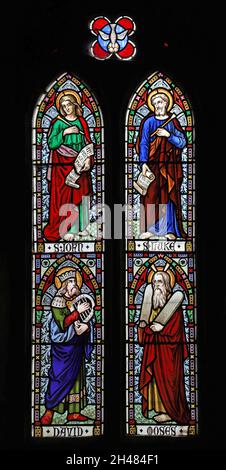 A stained glass window by Michale O'Connor depicting Saints Joan & Luke, and King David & Moses, St Michael & All Angels Church, Fringford, Oxfordshir Stock Photo