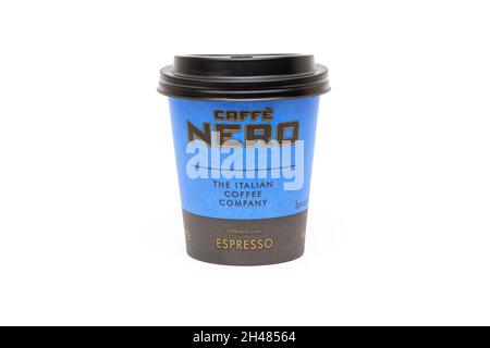 LONDON - OCT 21: Paper cup with Caffe Nero logotype Isolated on white. October 21. 2021 in UK. Nero is a British coffeehouse company headquartered in Stock Photo
