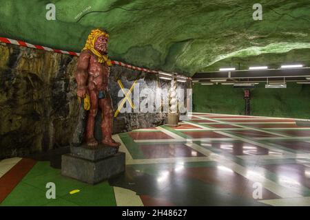 Stockholm, Sweden - 29 May 2016: Sculpture on the Kungstradgarden metro station, carved out of the rock. Green walls. Stock Photo