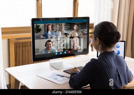 Happy Indian businesswoman holding video conference call. Stock Photo