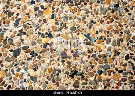 Closeup of a colorful pebble wash finish surface at the sidewalk in Philadelphia Pennsylvania Stock Photo