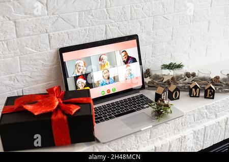 Christmas day Virtual meeting team teleworking. Family video call remote conference. Laptop webcam screen view. Diverse portrait headshots meet Stock Photo