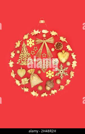 Christmas abstract round tree decoration concept with gold bauble decorations and ornaments on red background. Flat lay, top view, copy space.