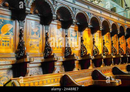 Choir stalls in Cathedral of San Lorenzo in Alba, Piedmonte Region, Italy. The cathedral is located in the eastern sector of the ancient city of Alba Stock Photo