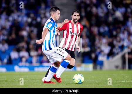 Martin Zubimendi of Real Sociedad and Raul Garcia of Athletic Club during the Spanish championship La Liga football match between Real Sociedad and Athletic Club on October 31, 2021 at Reale Arena in San Sebastian, Spain - Photo: Ricardo Larreina/DPPI/LiveMedia Stock Photo