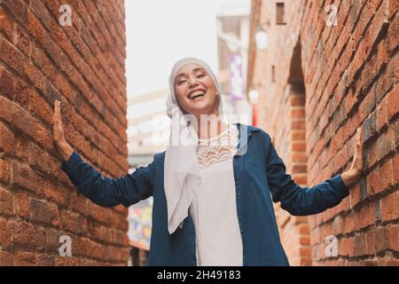 Modern muslim girl fashion with hijab.Beautiful Muslim female model wearing hijab and casual outfit posing on urban background Stock Photo Alamy