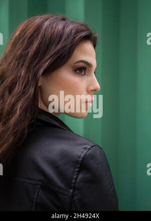 Portrait of a young woman in a black leather jacket Stock Photo