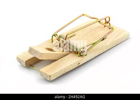 Macro photo of a spring loaded mousetrap, isolated on a white background, top view. Stock Photo