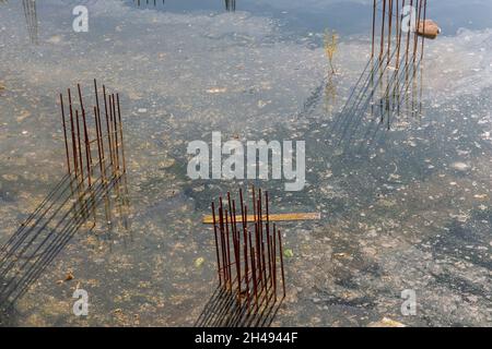 Water flooded at building under construction site during a hurricane Stock Photo